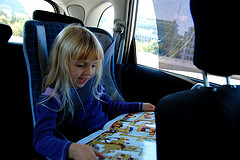 Child reading in a car